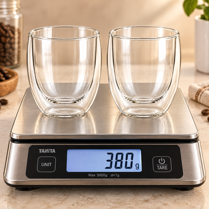 Matching pair of empty double-wall glass coffee cups